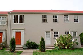San Francisco townhouse for rent - the front of a white building with a red door