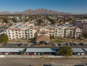 Las Vegas apartment for rent - an aerial view of an apartment complex with a mountain in the background