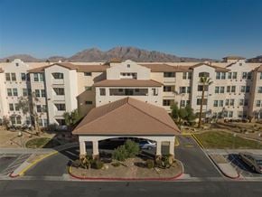 Las Vegas apartment for rent - an aerial view of an apartment complex with mountains in the background