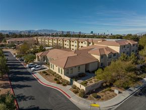 Las Vegas apartment for rent - an aerial view of an apartment complex with cars parked in front of it