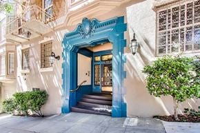 San Francisco apartment for rent - A blue doorway with a staircase leading up to it.
