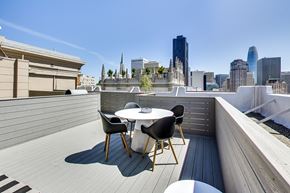 San Francisco apartment for rent - A table with chairs is set up on a rooftop terrace.