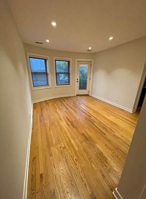 Chicago apartment for rent - a empty living room with a hard wood floor