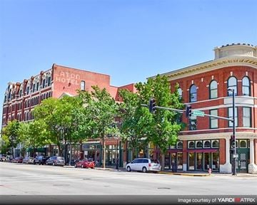 Wichita apartment for rent - a city street with several brick buildings and a traffic light