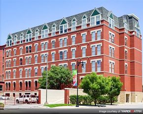 Wichita apartment for rent - a large red brick building on the side of a street