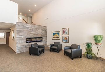 West Fargo apartment for rent - the preserve at ballantyne commons living room with chairs and a fireplace