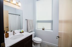 Sioux City apartment for rent - a small bathroom with a sink toilet and mirror