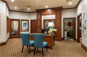 Houston apartment for rent - a dining room with a table and blue chairs