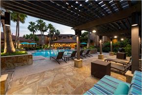 Houston apartment for rent - a swimming pool with lounge chairs and a covered patio