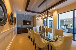 Houston apartment for rent - A dining room with a glass table and chairs.
