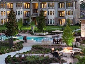 Tomball apartment for rent - the back yard of an upscale hotel with a swimming pool and patio
