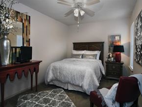 Conway apartment for rent - a bedroom with a bed and a ceiling fan