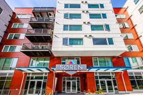 Seattle apartment for rent - a building with a sign in front of it