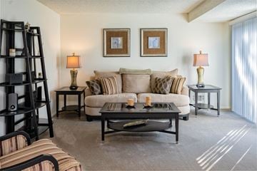 Rochester townhouse for rent - a living room with a couch and a table