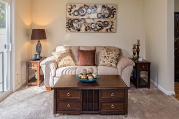 Farmington townhouse for rent - a living room with a couch and a coffee table
