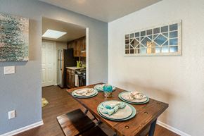 Okemos townhouse for rent - A dining room with a table set for two.