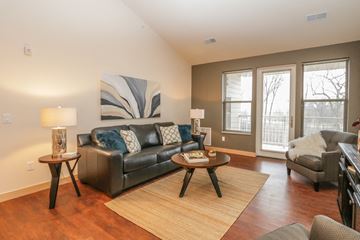 Sun Prairie apartment for rent - a living room with a couch and a chair and a table