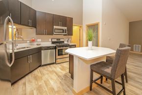 Sun Prairie apartment for rent - a kitchen with stainless steel appliances and a white counter top