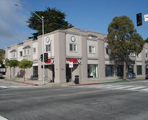 Monterey apartment for rent - a building on the corner of a street with a traffic light