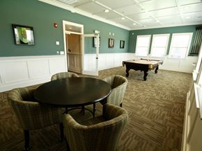 Sanford apartment for rent - A room with a pool table and chairs.