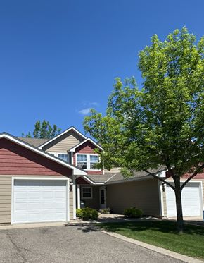 Albany townhouse for rent - A house with a red roof and a white garage door.