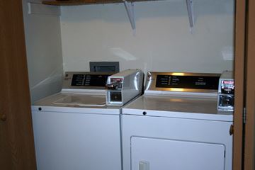 Albany townhouse for rent - A white dishwasher with a silver top is in a kitchen.