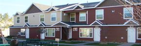 St Cloud townhouse for rent - a red house with a table in front of it