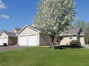 Mahtomedi apartment for rent - a house with a tree in front of it