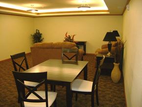 Maple Grove apartment for rent - A dining table with four chairs around it.