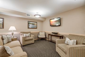 Plymouth apartment for rent - a living room with couches and chairs and a television
