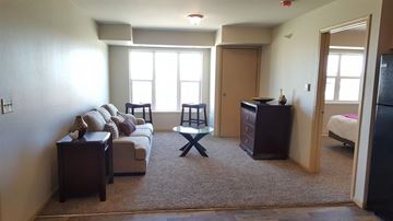 Roseau apartment for rent - a living room with a couch and a table