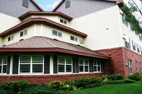 St Cloud apartment for rent - A house with a red roof and white walls.