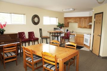 St Cloud apartment for rent - A kitchen with a table and chairs in the middle of the room.