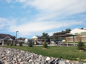 St Cloud townhouse for rent - a park with a pavilion and rocks in the grass