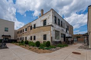 St Paul apartment for rent - the exterior of a brick building with a courtyard in front of it