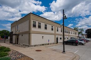 St Paul apartment for rent - a large building with cars parked in a parking lot
