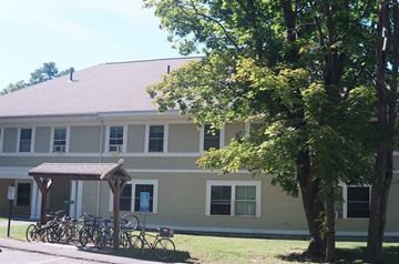 Northampton apartment for rent - A building with a bicycle parking area in front.