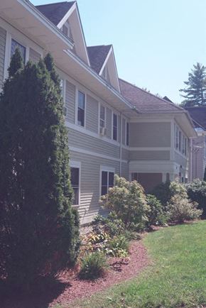Northampton apartment for rent - A house with a red roof and a tree in front.