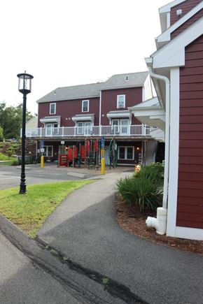 Amherst apartment for rent - a walkway in front of a building with a porch
