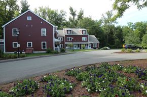 Amherst apartment for rent - a view of a house and a street with a flower garden