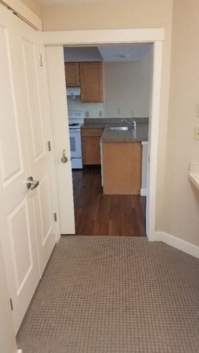 Amherst apartment for rent - an empty kitchen with a door open to a