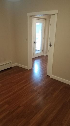 Amherst apartment for rent - a room with a hard wood floor and a door