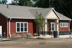 Easthampton apartment for rent - a small red house with a bench in front of it