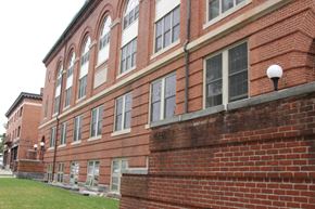 Ludlow apartment for rent - the side of a brick building with a lawn