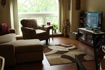 Ludlow apartment for rent - a living room with a couch and a chair and a television