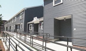 Holyoke townhouse for rent - a row of rental buildings with metal railings