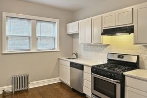 Oak Park apartment for rent - A kitchen with a stove, dishwasher, and window.