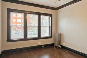 Oak Park apartment for rent - A room with a window and a radiator on the floor.