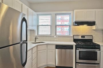 Oak Park apartment for rent - A kitchen with a stainless steel refrigerator, stove, and dishwasher.