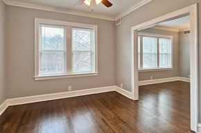Oak Park apartment for rent - A room with a ceiling fan and two windows.